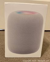 Sealed front of box showing HomePod image and packaging