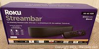 Front side of the Roku Streambar box showing product name, 4K streaming, premium audio, Dolby Audio, Bluetooth and other features.