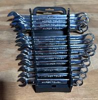 Front view of 12 Hyper Tough combination wrenches arranged on a black plastic holder.