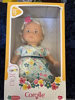 Front of original Corolle doll box showing the doll 'Jasmine' inside, 13 inches tall in floral dress.