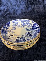 Stack of six Blue Mikado pattern fruit dessert bowls with gold rims