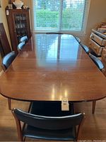 Top view of fully extended table with chairs around