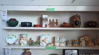 Wide view of shelving with assorted decorative pieces including baskets, figurines, and containers
