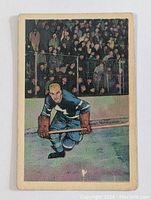 Front of 1952-53 Parkhurst Bob Solinger hockey card in Toronto Maple Leafs uniform on ice with crowd background.