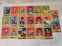 Photo showing 20 hockey cards including Gary Smith, Hart Memorial Trophy, Bob Baun, and more.