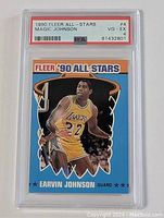 Encapsulated 1990 Fleer Magic Johnson All-Star basketball card with PSA grading visible, grade VG-EX 4, showing front of card and label.