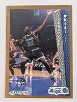 Front view of the 1993 Fleer Shaquille O'Neal rookie card showing him in action in an Orlando Magic uniform with team and Fleer logos.