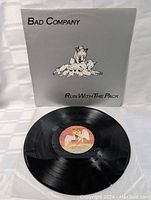 Photo showing the vinyl record with label, featuring winged horse design