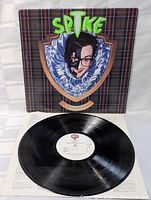 Photo of the vinyl record taken out of the cover, showing label and surface condition.