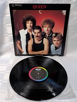 Front view of Queen Radio Ga Ga 12" single vinyl record with cover showing band members and title