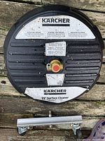 Top view of one 15 inch Karcher surface cleaner pressure washer attachment showing the connection port and branding