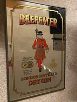 Photo of Beefeater London Dry Gin mirror beer sign showing design and size