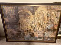 Framed cubist-style painting showing abstract geometric shapes that combine into a figure with halos and praying hands from different angles
