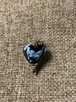 Front view of the Murano glass heart pendant showing floral pattern and gold-tone decorative elements