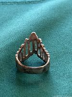 Ring showing front view of 'V' shaped bright cut design and open bottom detail.