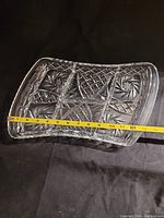 Top view of the vintage crystal serving dish with a measuring tape showing length approximately 11 inches.