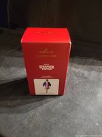 Front view of the red Hallmark Keepsake 2021 box showing the Eleven ornament image and logos.