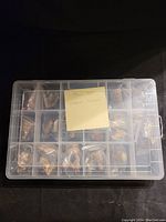 Full set of Wade nursery rhyme figurines inside a clear plastic compartmentalized box. Figurines individually bagged in each compartment.