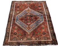 Full view of rectangular rug showing central medallion and overall pattern