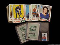 Stack of 1969 Topps hockey cards with inserts in front