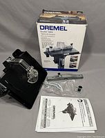 Main Dremel router table 231 unit with safety shield and original box in background.