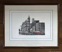 Framed limited edition print showing the entire artwork and matting with dark brown wooden frame visible.