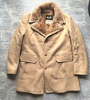 Full front view of the men's vintage MacMor wool coat showing the caramel wool material and button closure with flap pockets.