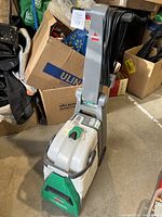 Front view of the upright Bissell Big Green carpet cleaner showing full unit.