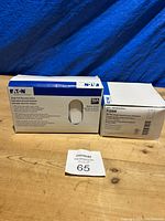 Box of Eaton single pole decorator switches rated 15A, sealed in original packaging.