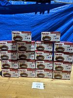 Full lot of 18 boxed Topstar Hitech pot lights stacked in a pyramid formation.