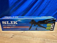 Box front showing Slik F740 branding and product image against blue background