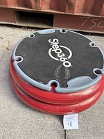 View of Step360 Pro balance trainer showing top platform with logo and red inflatable base.