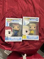 Photo of two boxed Funko Pop figures from NSYNC series: Lance Bass (#113) and Joey Fatone (#114) showing front packaging and figure details.