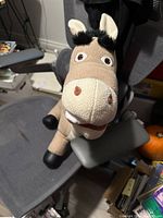Front and side views of the Donkey plushie from Shrek with clear facial features and details visible.