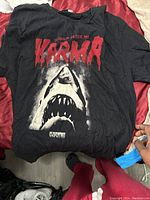 Black T-shirt with large shark graphic and 'Karma' text.