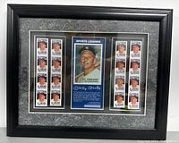 Front view of framed limited edition Mickey Mantle stamps set with central sports legend card and side stamp panels