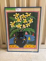 Full view of the framed Ken Done print titled 'Frangipani' showing the artwork and frame.