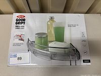 Front of box showing product image and OXO Good Grips branding for corner caddy