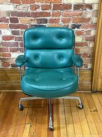 Front view showing overall shape, color, tufted seat and back cushions