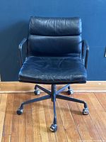 Front view of chair showing seat cushion, backrest, base, and casters