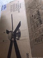 Closed original box featuring image and specifications of the Hugger 52-inch large room ceiling fan.