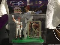 Photo of Mark McGwire collectible figurine in original Starting Lineup 2000 packaging, showing front views of figurine and card.