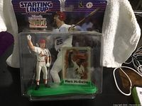 Front view of Mark McGwire Starting Lineup figurine and card in original packaging showing figure in batting pose and included card