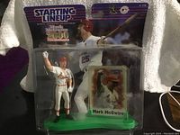 Front view of the packaged Mark McGwire figurine with card showing the Starting Lineup 2000 logo and image of McGwire swinging a bat