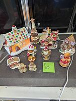 Full set of 10 gingerbread village pieces, houses and figures, displayed together