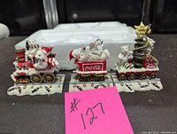 Front view of the Coca Cola Polar Bear Express three-piece train set with decorated polar bears and holiday themes