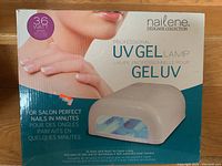 Box of Nailene Professional UV Gel Lamp showing branding and product details.