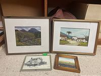 Photo showing the four framed pieces arranged on floor including the Farmhouse below Tryfan Snowdonia print and others