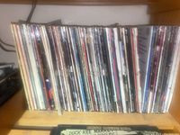 Shelf with a row of vinyl LP records showing spines