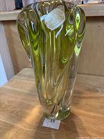 Front view of lime green and clear Bohemia glass art vase with original sticker visible on surface.